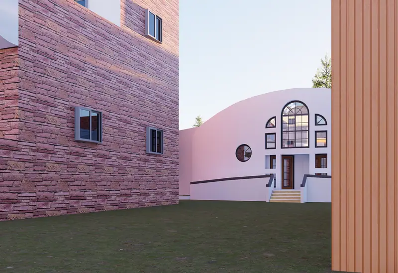 Courtyard between a stone-clad building and the curved early-years building with arched windows